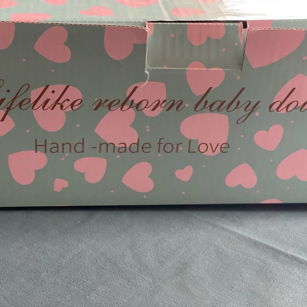 Real baby doll for kids still in the original box no damage Almost new .